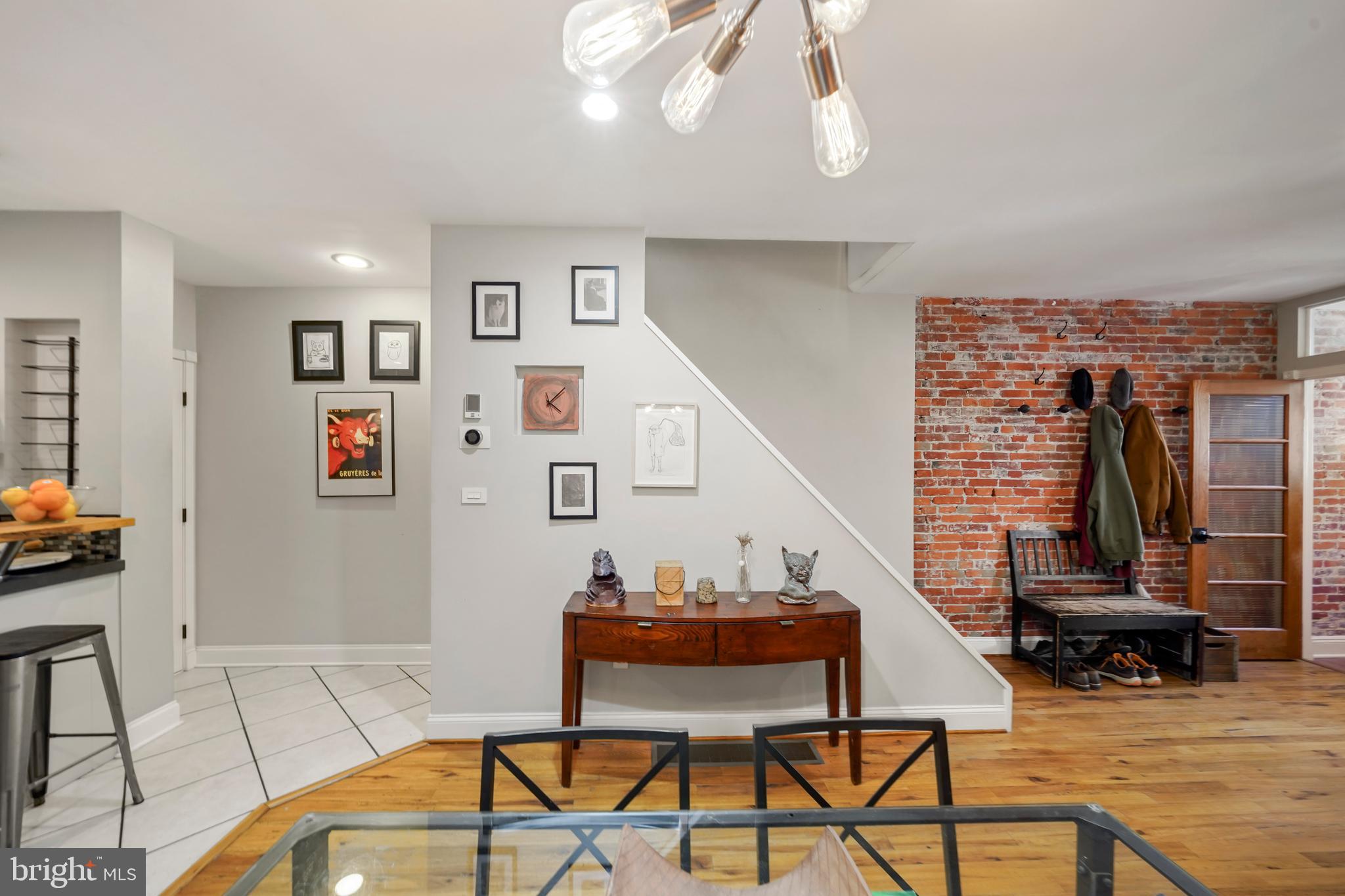 1318 South Alder Street Philadelphia, PA 19147 - Photo 10 of 39 a living room with furniture a flat screen tv and a table