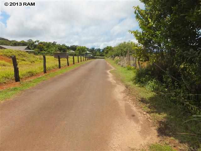 0 Hog Back Road, Unit LOT 17 Haiku, HI 96708 - Photo 3 of 11 a view of a lake with houses in the back
