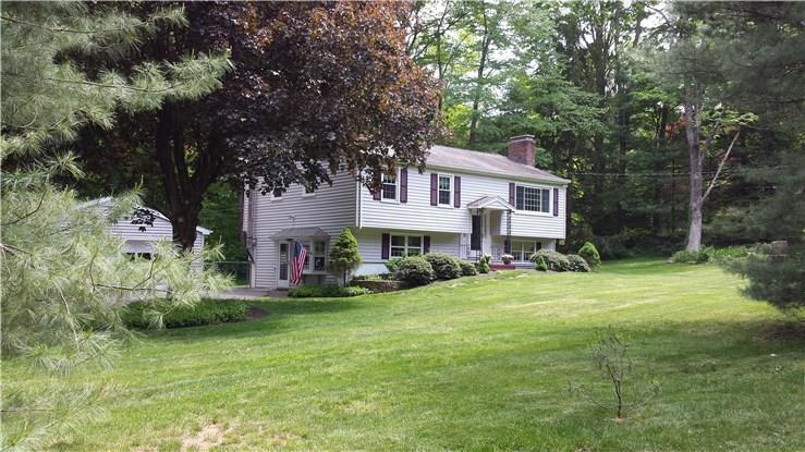31 Ashbee Lane Ridgefield, CT 06877 - Photo 1 of 1 a front view of house with yard and trees