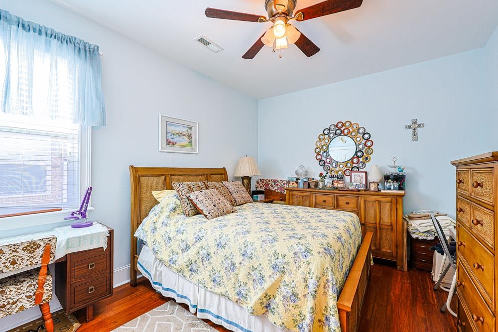 232 Waterfall Circle Little River, SC 29566 - Photo 21 of 40 Bedroom with dark wood finished floors and ceiling fan