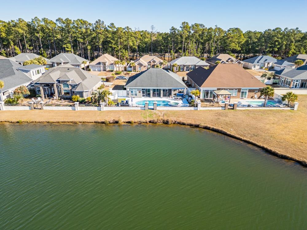 232 Waterfall Circle Little River, SC 29566 - Photo 35 of 40 Aerial perspective of suburban area featuring a tree filled landscape and a nearby body of water