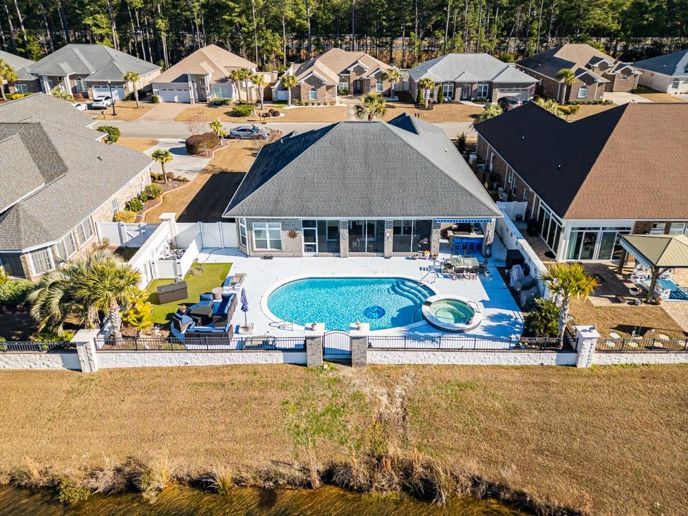 232 Waterfall Circle Little River, SC 29566 - Photo 36 of 40 View of pool with a patio area, a fenced backyard, an outdoor hangout area, a pool with connected hot tub, and a residential view