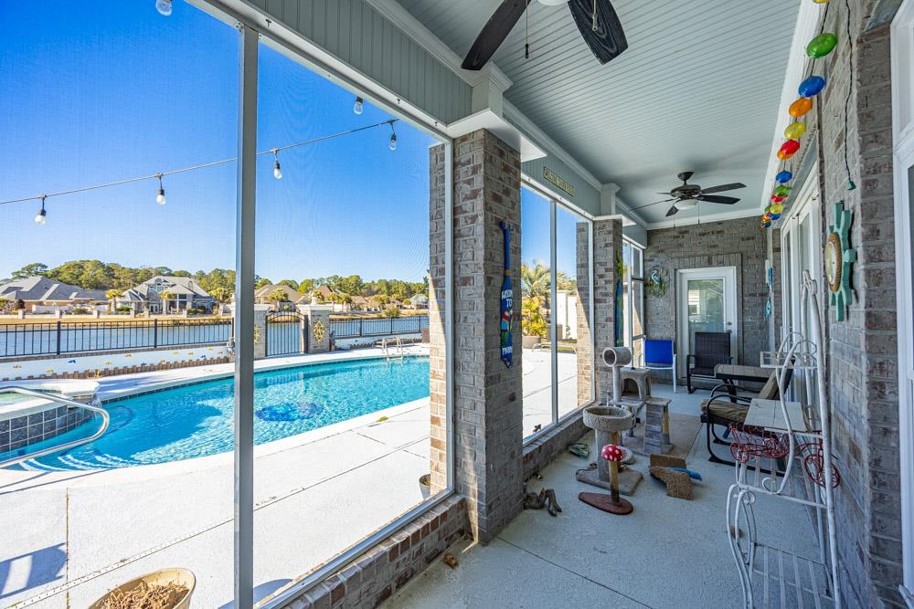 232 Waterfall Circle Little River, SC 29566 - Photo 6 of 40 View of swimming pool with a fenced backyard, a patio area, a residential view, and a pool with connected hot tub