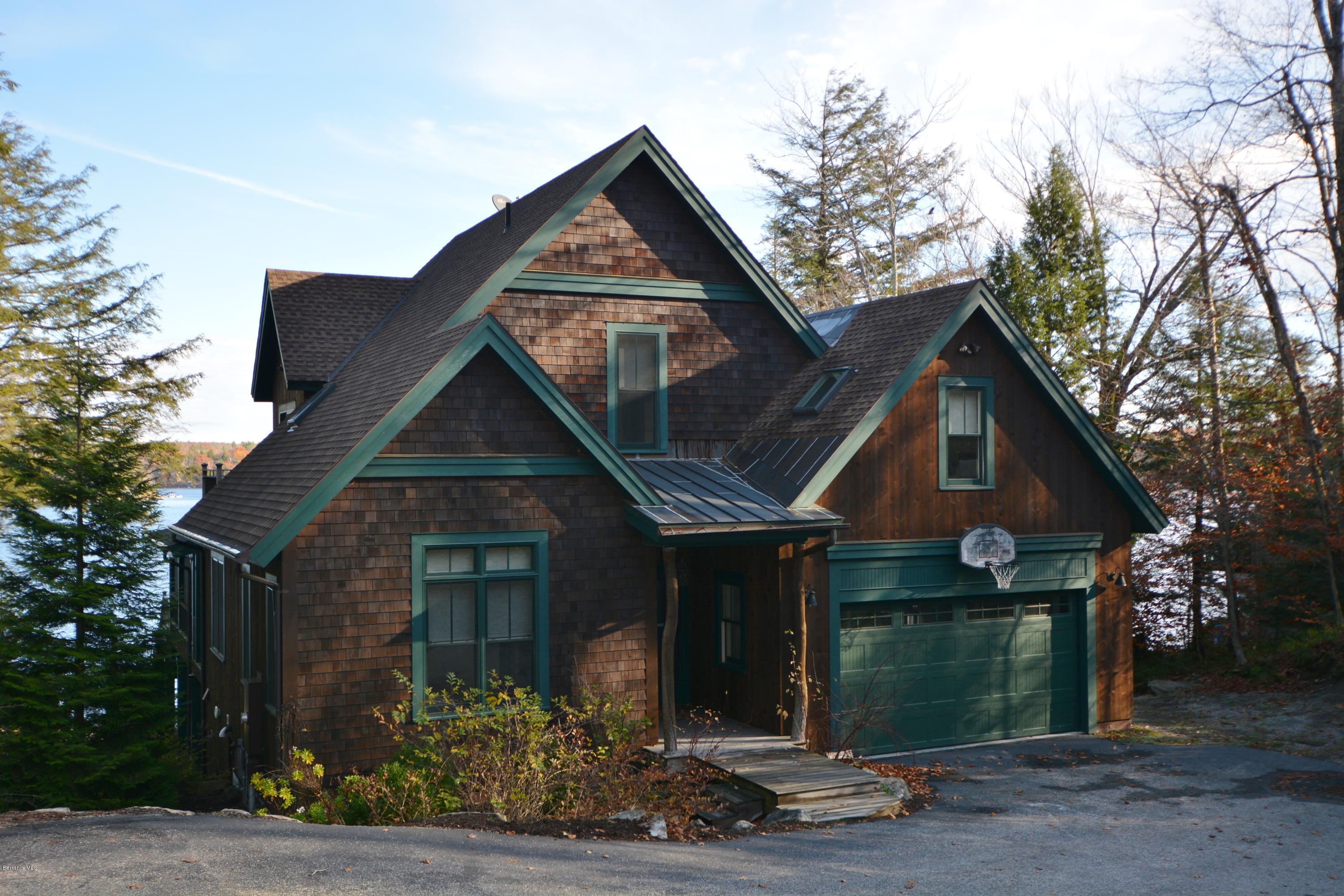 66 Mallard Road Otis, MA 01029 - Photo 2 of 26 a front view of a house with garden