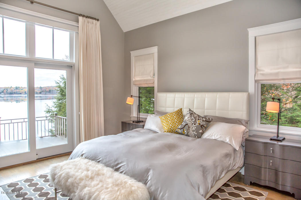 66 Mallard Road Otis, MA 01029 - Photo 14 of 26 a bedroom with a large bed and a large window