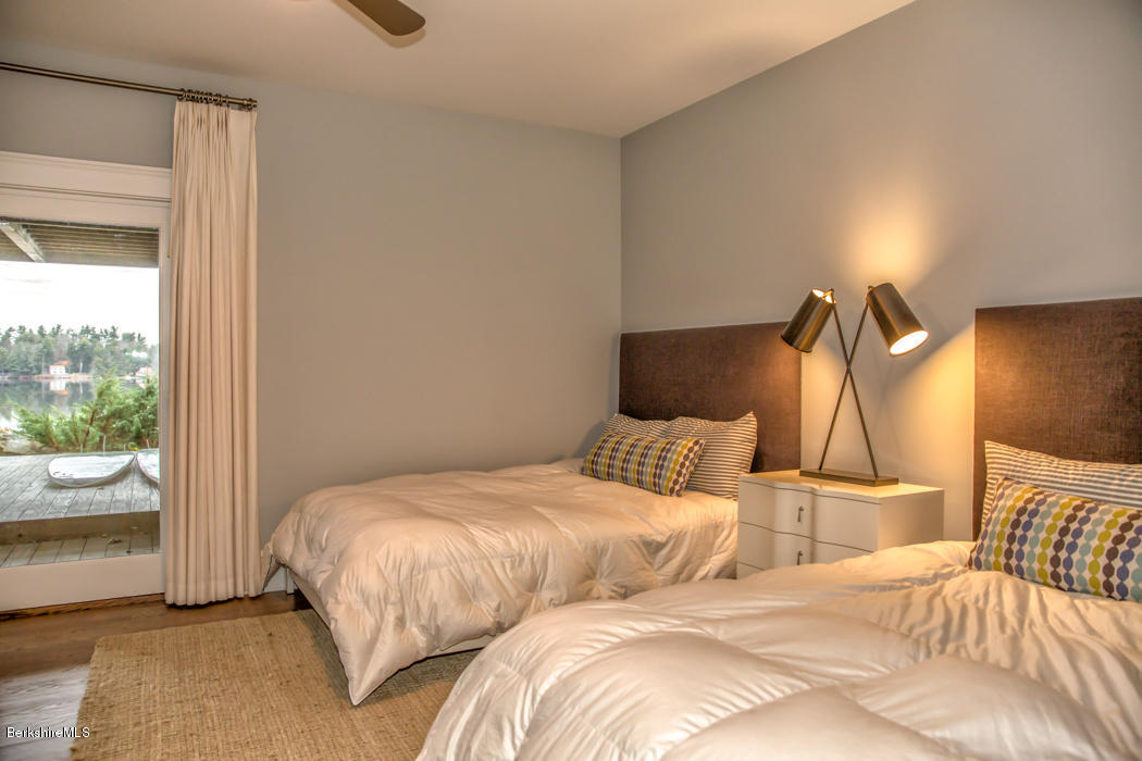 66 Mallard Road Otis, MA 01029 - Photo 20 of 26 a bedroom with two beds and painted walls
