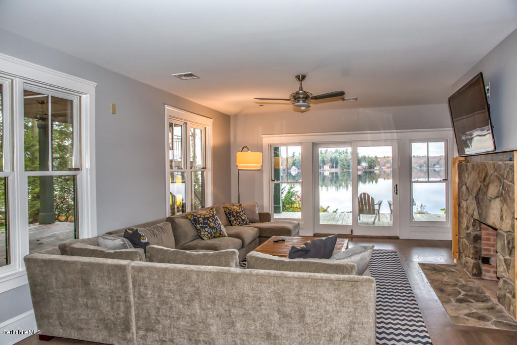 66 Mallard Road Otis, MA 01029 - Photo 22 of 26 a living room with fireplace furniture and a large window
