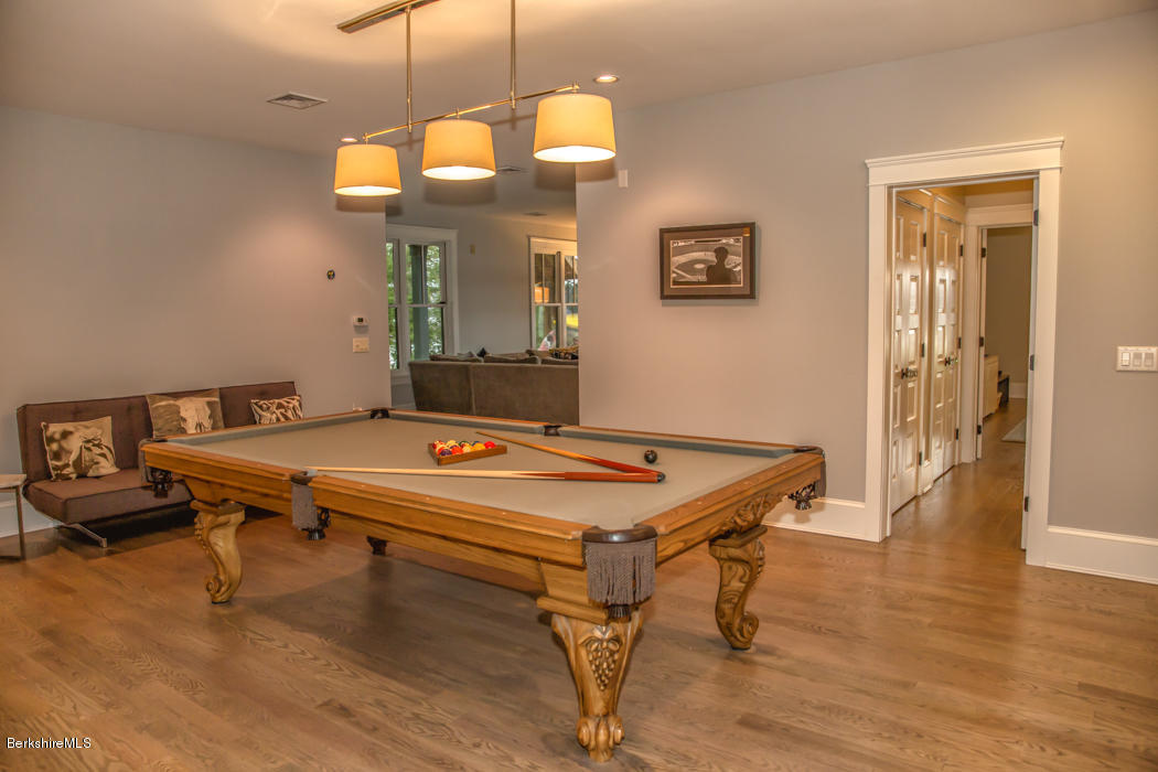 66 Mallard Road Otis, MA 01029 - Photo 24 of 26 a room with table chairs and wooden floor