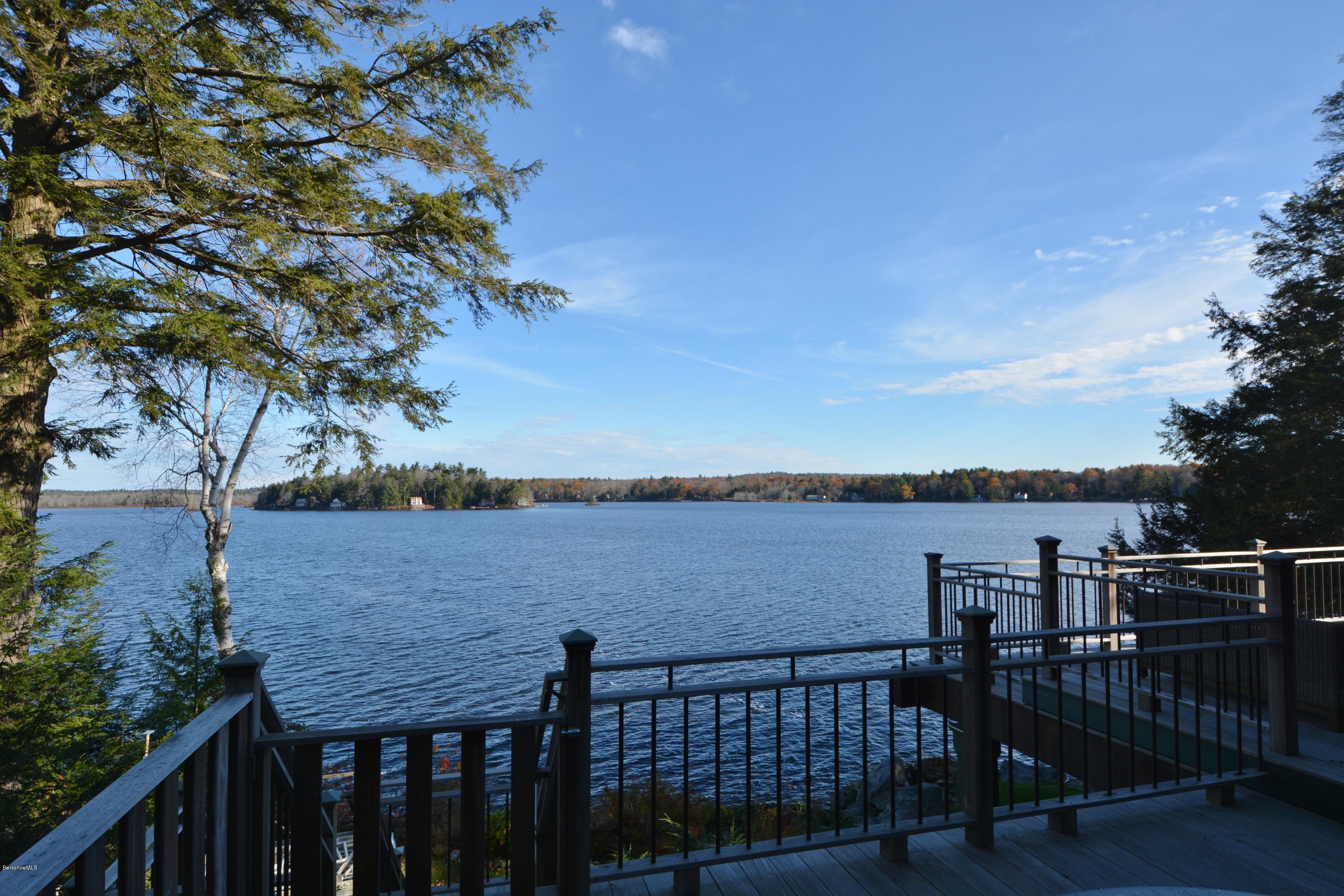 66 Mallard Road Otis, MA 01029 - Photo 4 of 26 a view of a roof deck with couches and wooden floor