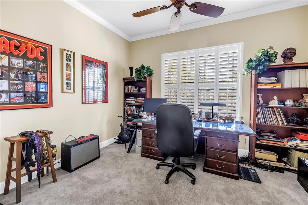 2101 North Pointe Alexis Drive, Unit 1 Tarpon Springs, FL 34689 - Photo 12 of 63 a view of a workspace with workspace and a window