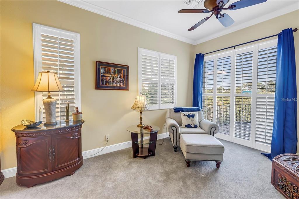 2101 North Pointe Alexis Drive, Unit 1 Tarpon Springs, FL 34689 - Photo 14 of 63 a living room with furniture and a window