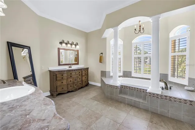 a bathroom with a toilet sink and shower