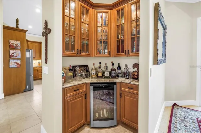 a kitchen with stainless steel appliances granite countertop a sink and refrigerator