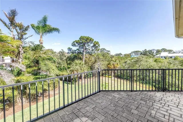 a work room with furniture a rug and white walls