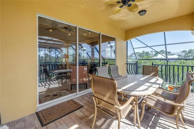 a room with pool table and windows