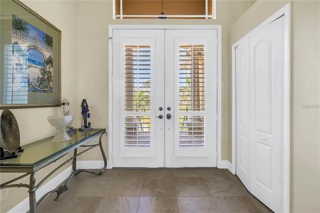 a view of a hallway with workspace and windows