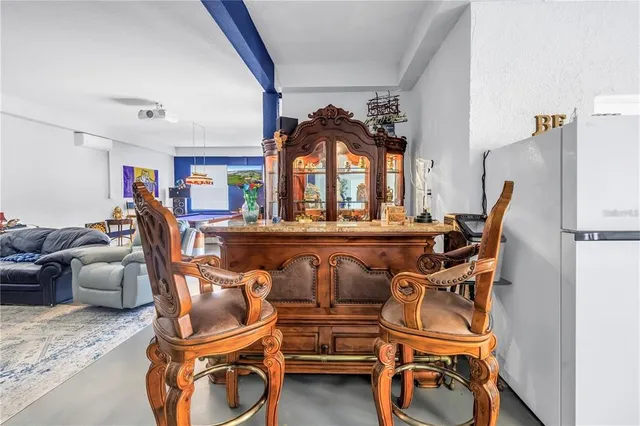 a view of a garage with rack and bicycle