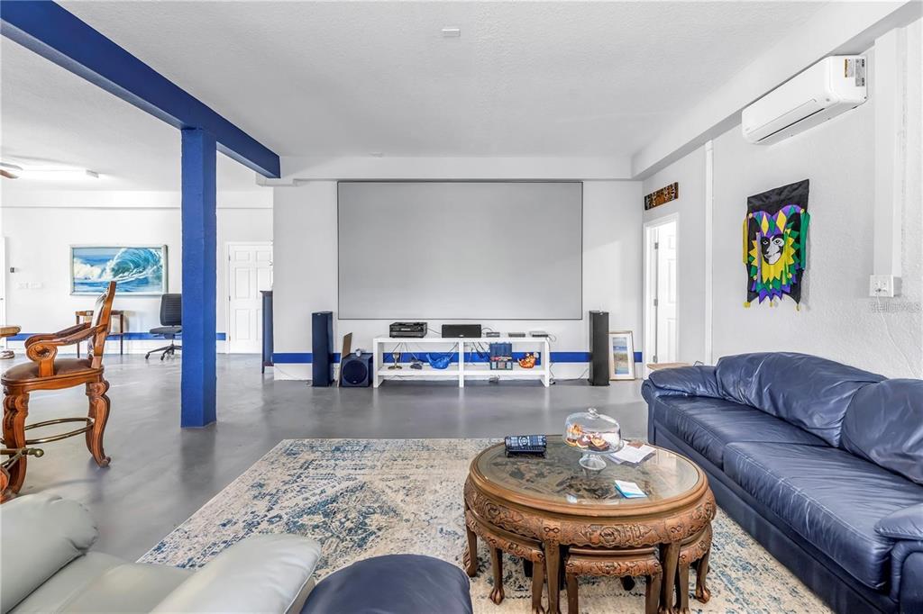 2101 North Pointe Alexis Drive, Unit 1 Tarpon Springs, FL 34689 - Photo 46 of 63 a living room with furniture and a dining table with kitchen view