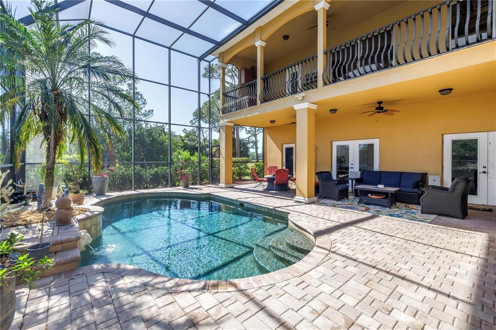 2101 North Pointe Alexis Drive, Unit 1 Tarpon Springs, FL 34689 - Photo 50 of 63 a view of a swimming pool with sitting area