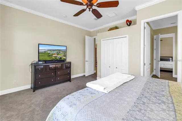 a bedroom with a bed and a dresser in it
