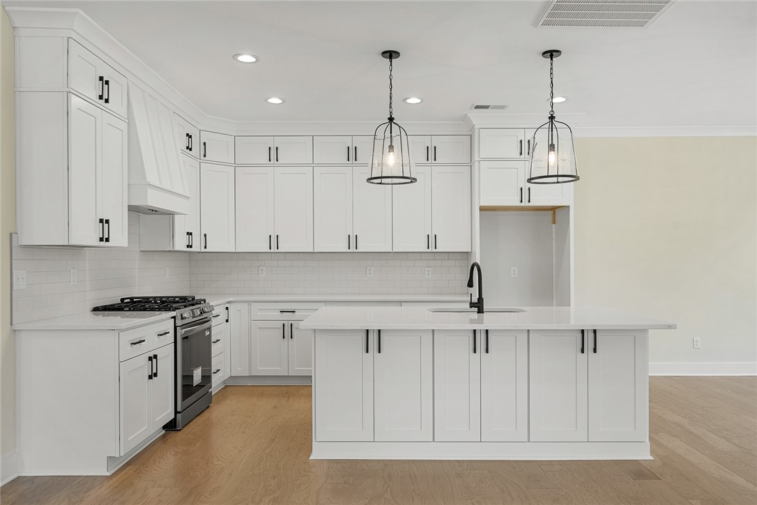 100 Garden Gate Drive Anderson, SC 29621 - Photo 12 of 43 This kitchen features a sleek design with ample cabinetry and a functional island.