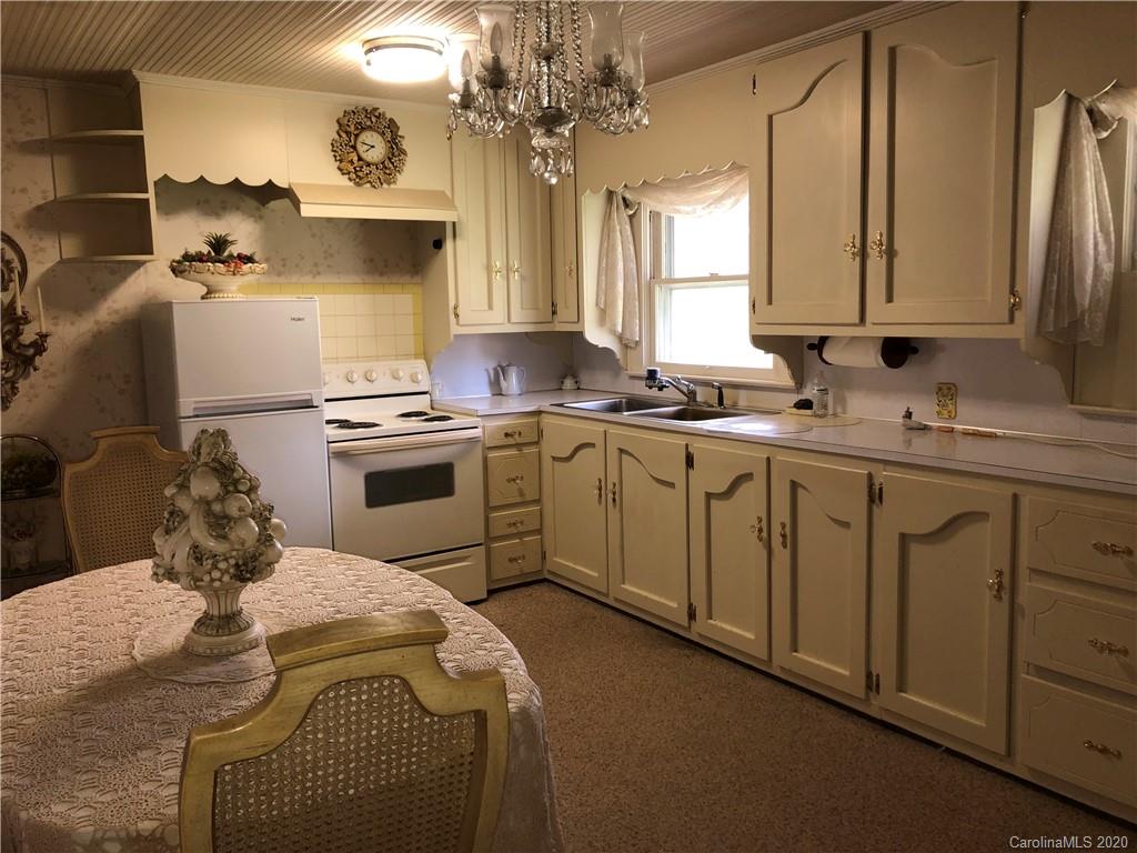 6234 Cress Road Concord, NC 28025 - Photo 13 of 24 a kitchen with a sink appliances and cabinets