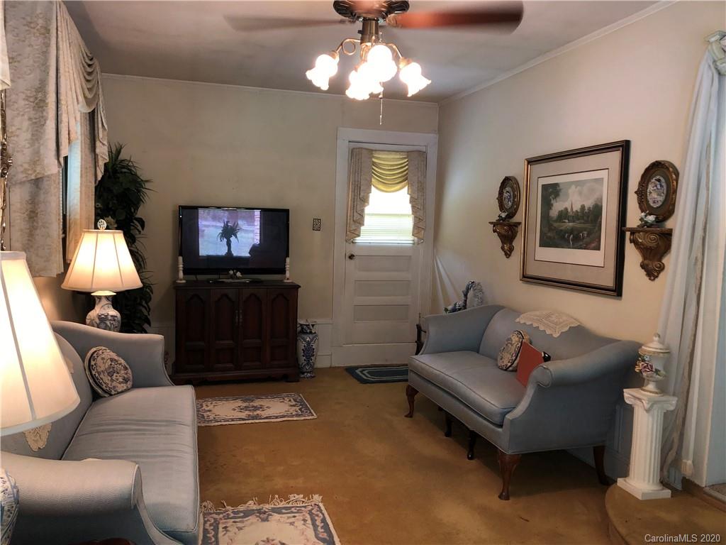 6234 Cress Road Concord, NC 28025 - Photo 17 of 24 a living room with furniture and a flat screen tv