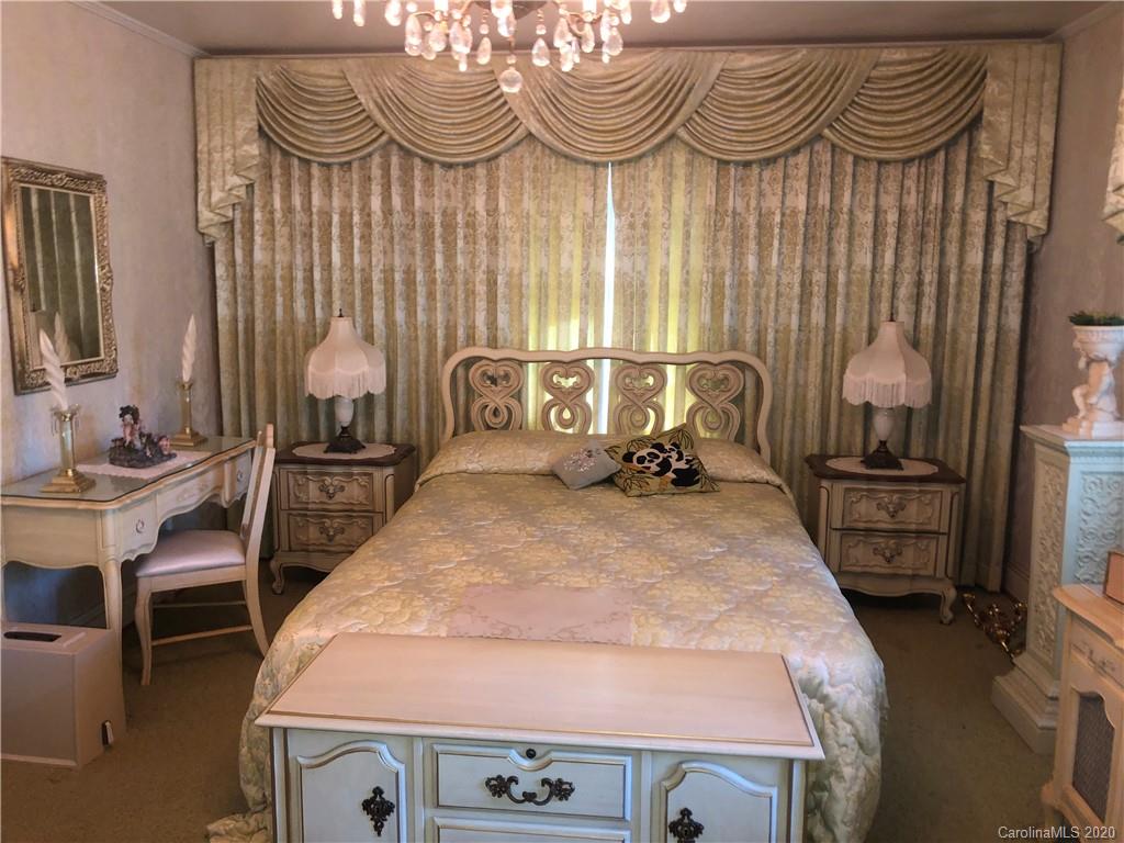 6234 Cress Road Concord, NC 28025 - Photo 19 of 24 a bed room with a bed and a chair in it