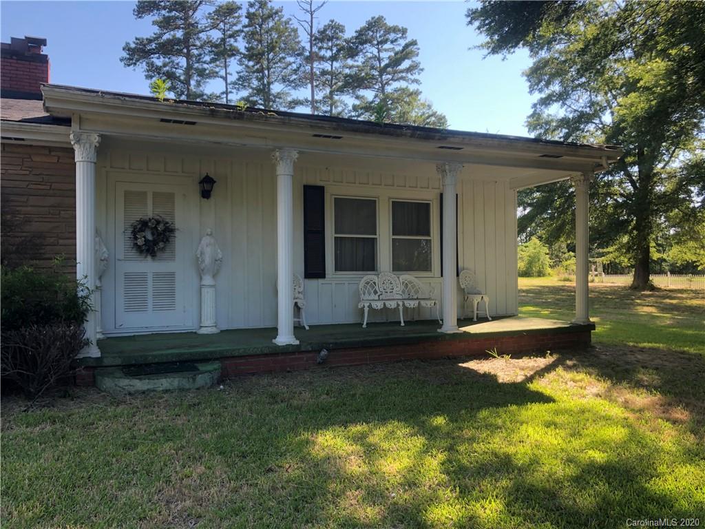 6234 Cress Road Concord, NC 28025 - Photo 3 of 24 a front view of a house with a yard