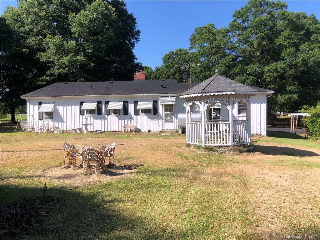 6234 Cress Road Concord, NC 28025 - Photo 4 of 24 a front view of a house with a yard