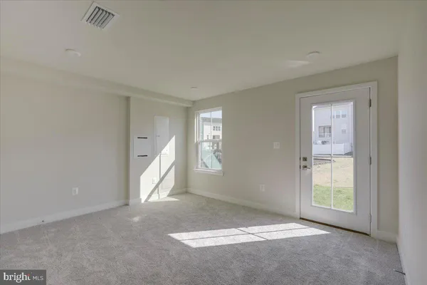 a large kitchen with stainless steel appliances refrigerator sink and cabinets