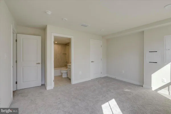 a large kitchen with kitchen island a sink stainless steel appliances and cabinets