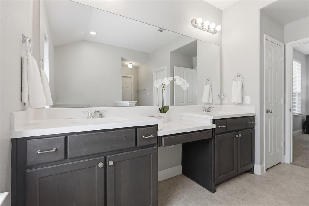 717 Allbright Road Celina, TX 75009 - Photo 19 of 37 Garden tub, dual sinks, linen closet. Separate walk in shower