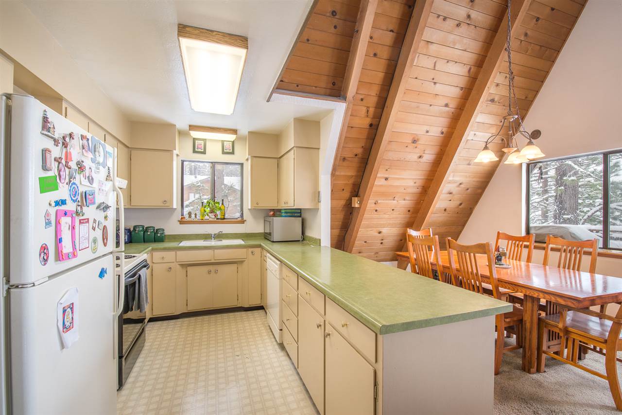 14060 Donner Pass Road Truckee, CA 96161 - Photo 2 of 14 a kitchen with a stove a sink and a refrigerator