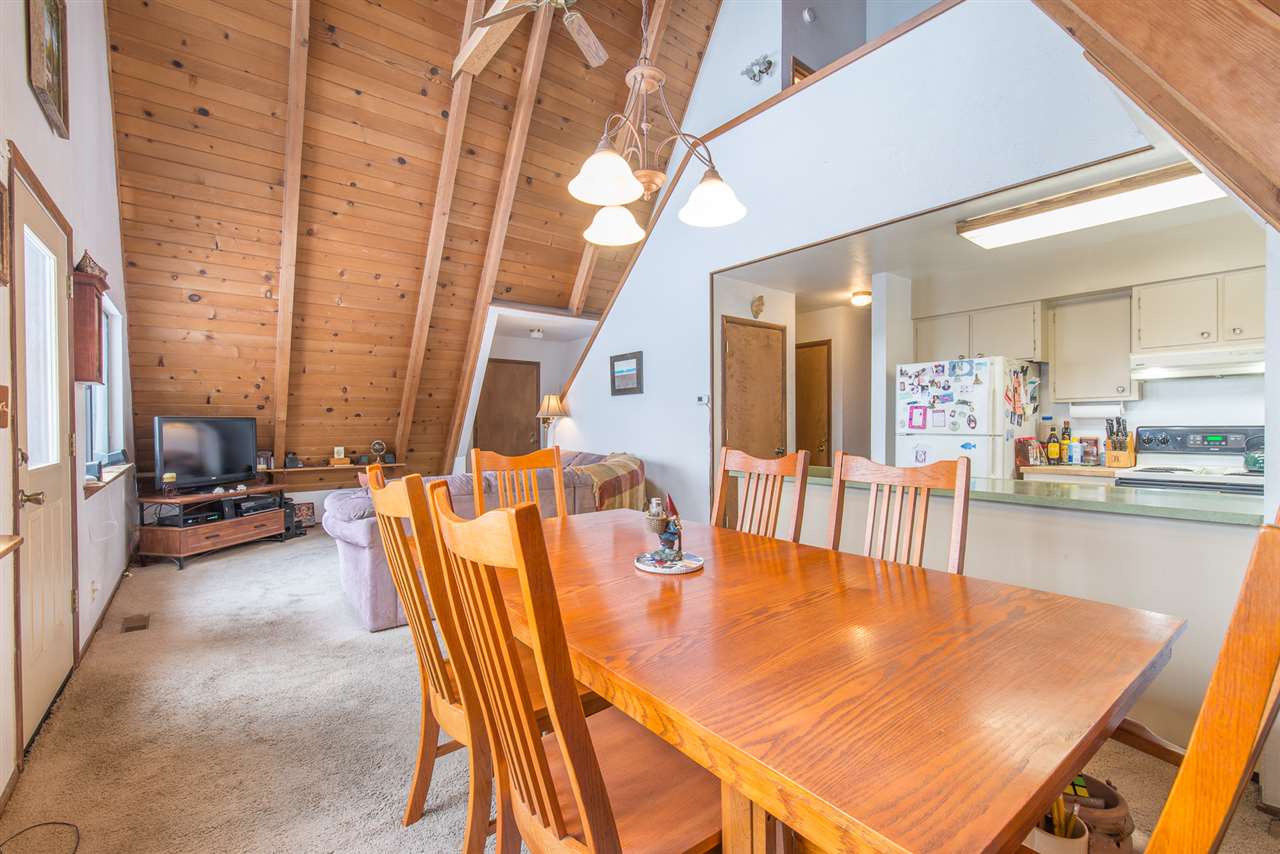 14060 Donner Pass Road Truckee, CA 96161 - Photo 3 of 14 a view of a dining room with furniture and a chandelier