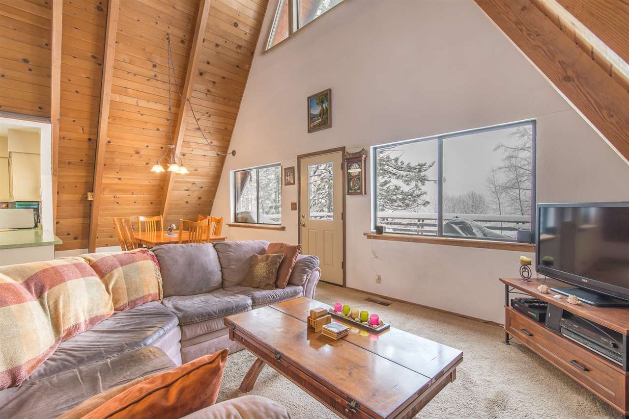 14060 Donner Pass Road Truckee, CA 96161 - Photo 5 of 14 a living room with furniture and a flat screen tv