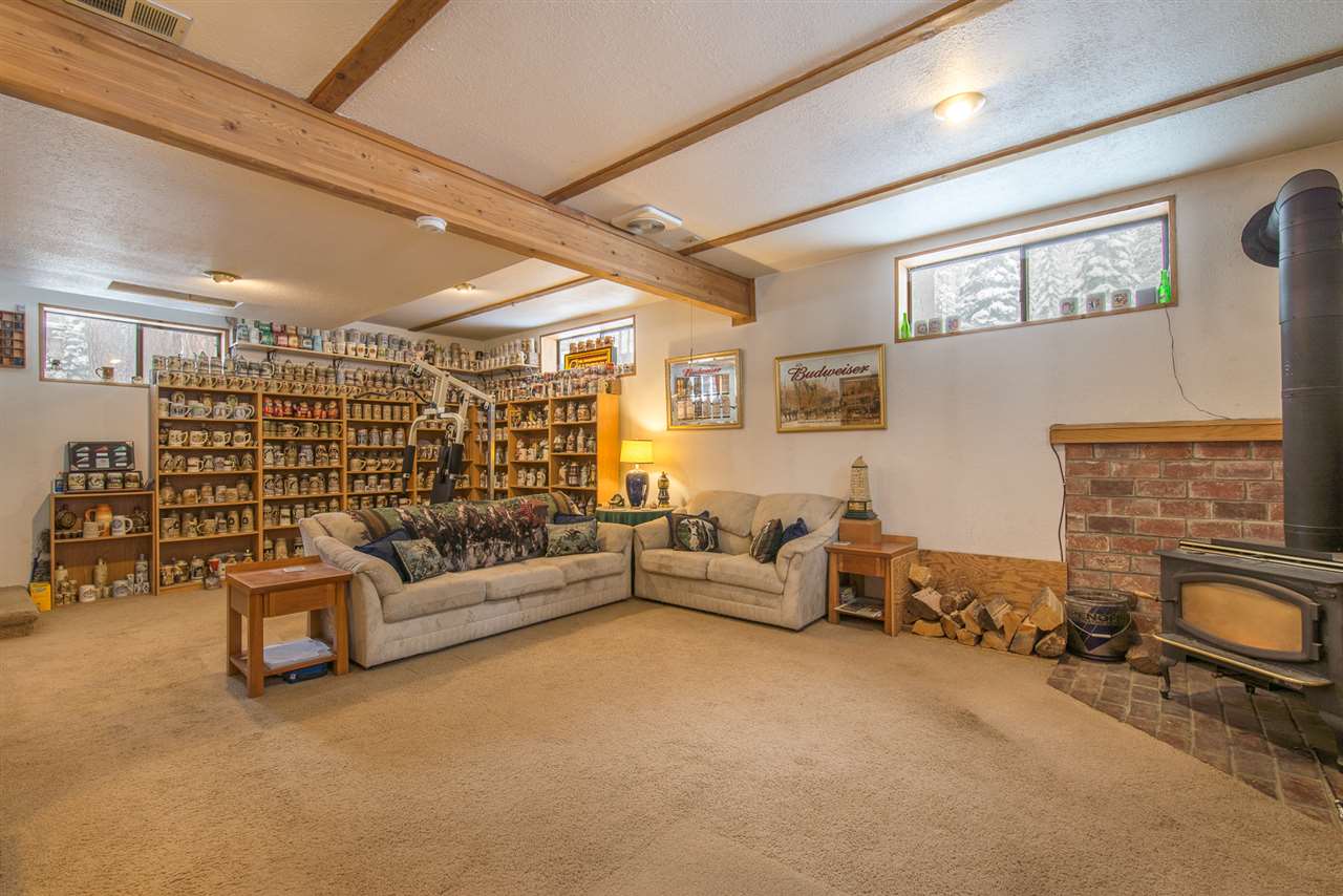 14060 Donner Pass Road Truckee, CA 96161 - Photo 8 of 14 a living room with furniture and a fireplace