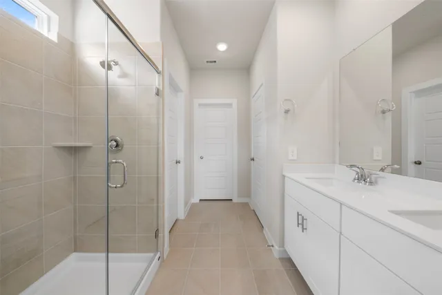 a spacious bathroom with a shower and a sink