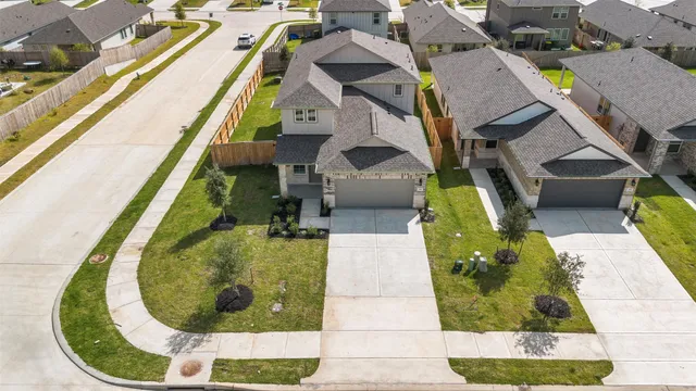 an aerial view of a house with swimming pool