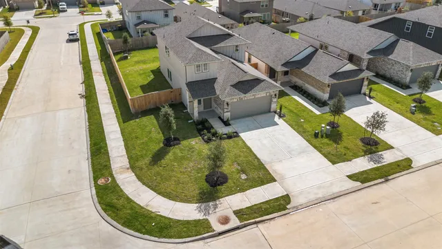 an aerial view of a house with swimming pool