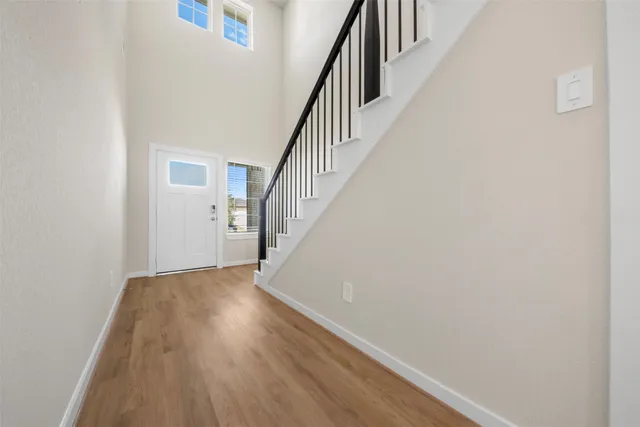 a view of entryway with wooden floor