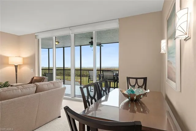 a kitchen with kitchen island granite countertop a stove a sink and a refrigerator