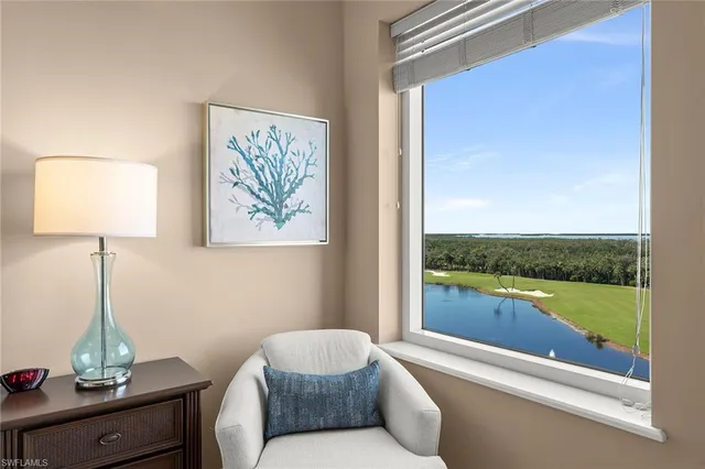 a bedroom with a bed and a night stand