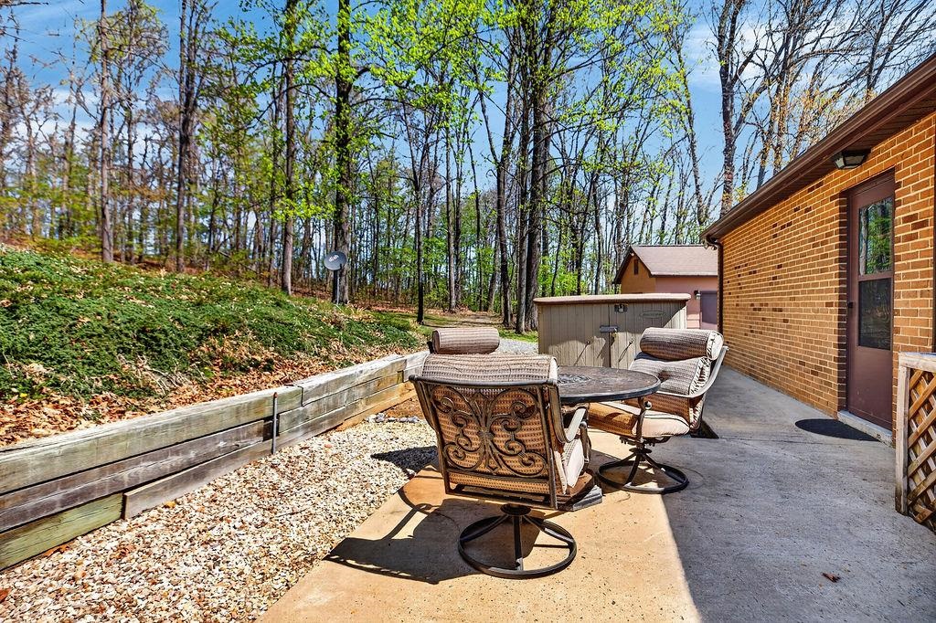 329 Red Hill Road Fairfield, VA 24435 - Photo 48 of 74 a view of a backyard with table and chairs and potted plants