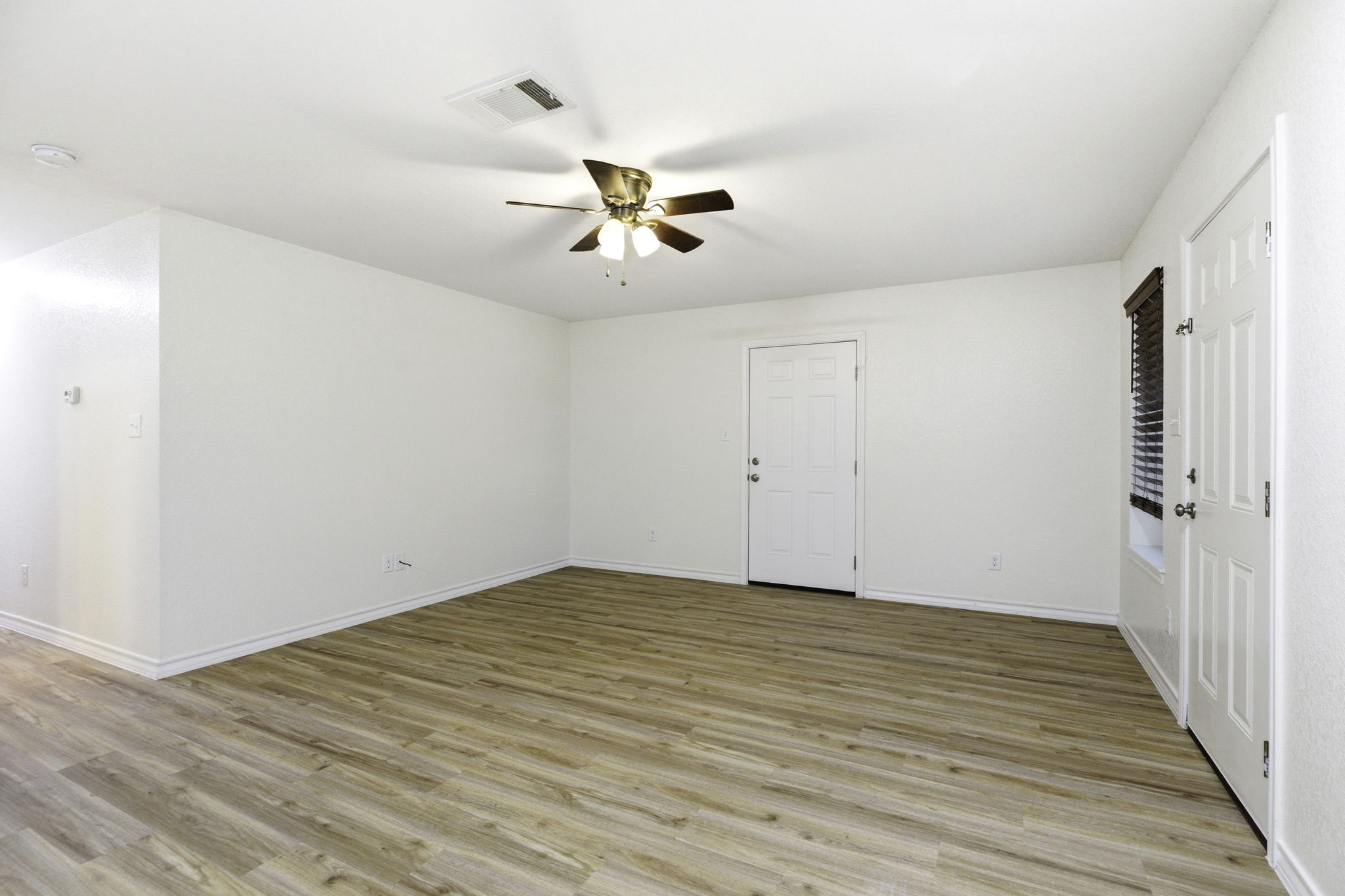 823 North Commerce Street, Unit A Lockhart, TX 78644 - Photo 13 of 28 wooden floor in an empty room