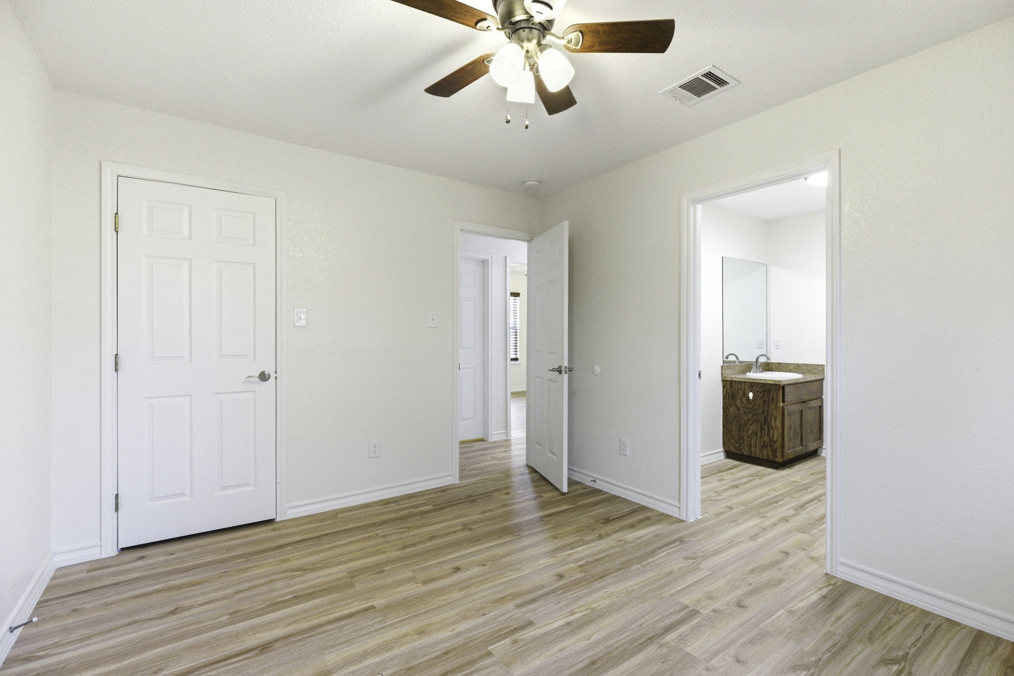 823 North Commerce Street, Unit A Lockhart, TX 78644 - Photo 20 of 28 a view of an empty room with a ceiling fan