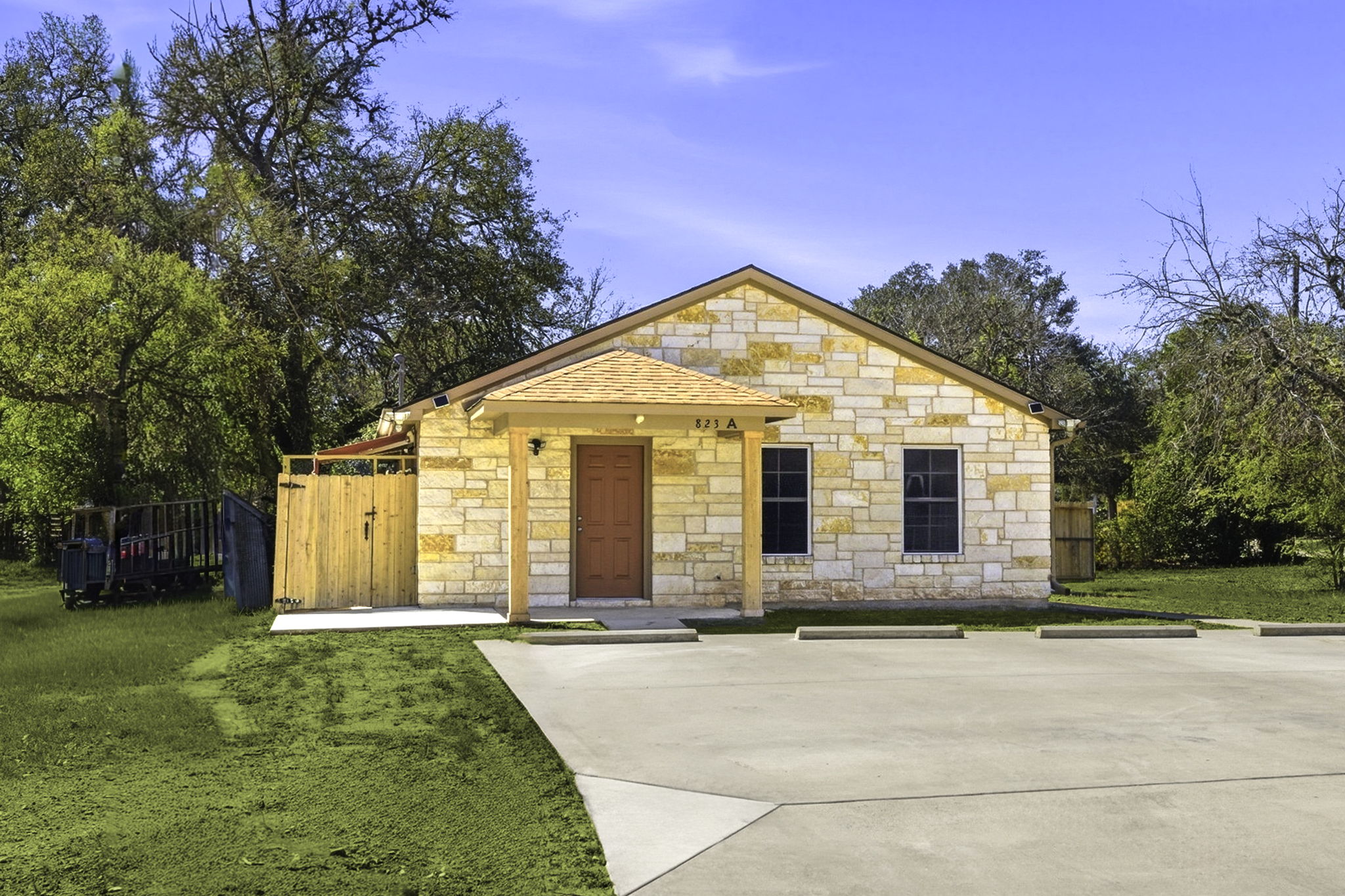 823 North Commerce Street, Unit A Lockhart, TX 78644 - Photo 2 of 28 a front view of a house with a yard