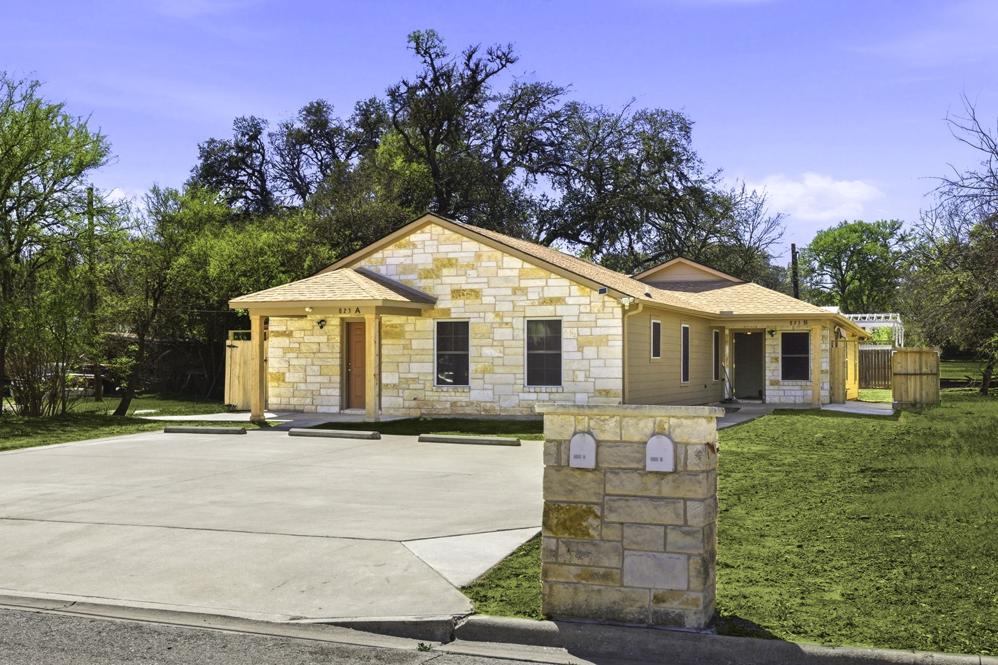 823 North Commerce Street, Unit A Lockhart, TX 78644 - Photo 3 of 28 a front view of a house with a yard