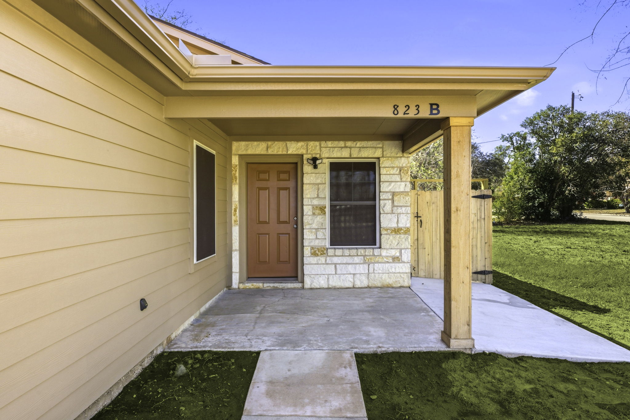 823 North Commerce Street, Unit A Lockhart, TX 78644 - Photo 5 of 28 a front view of a house with a yard