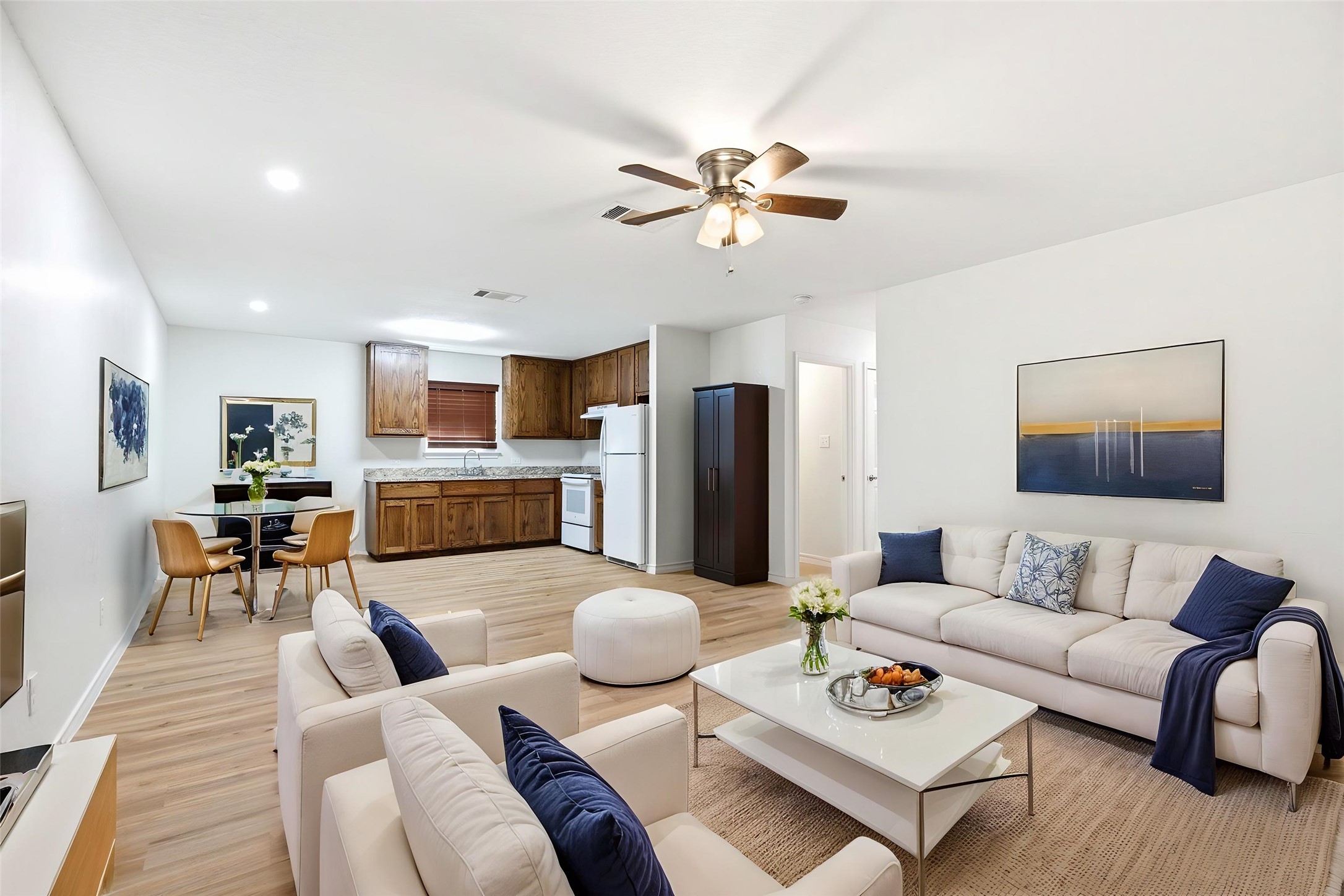 823 North Commerce Street, Unit A Lockhart, TX 78644 - Photo 6 of 28 a living room with furniture kitchen view and a chandelier